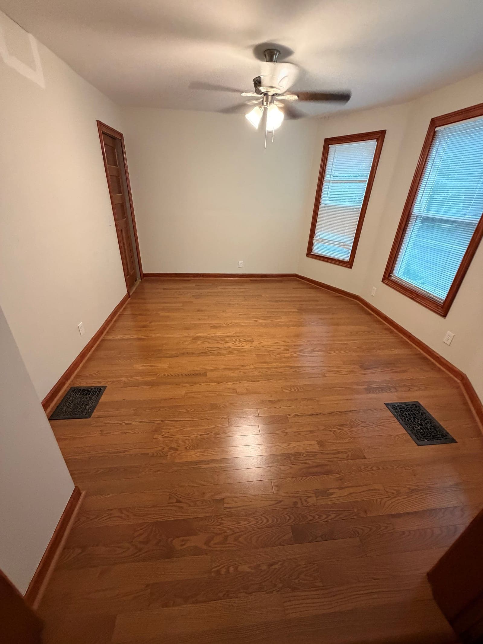 Appalachian Red Oak Excel Honey solid hardwood installed in a West Hartford room with wood trim