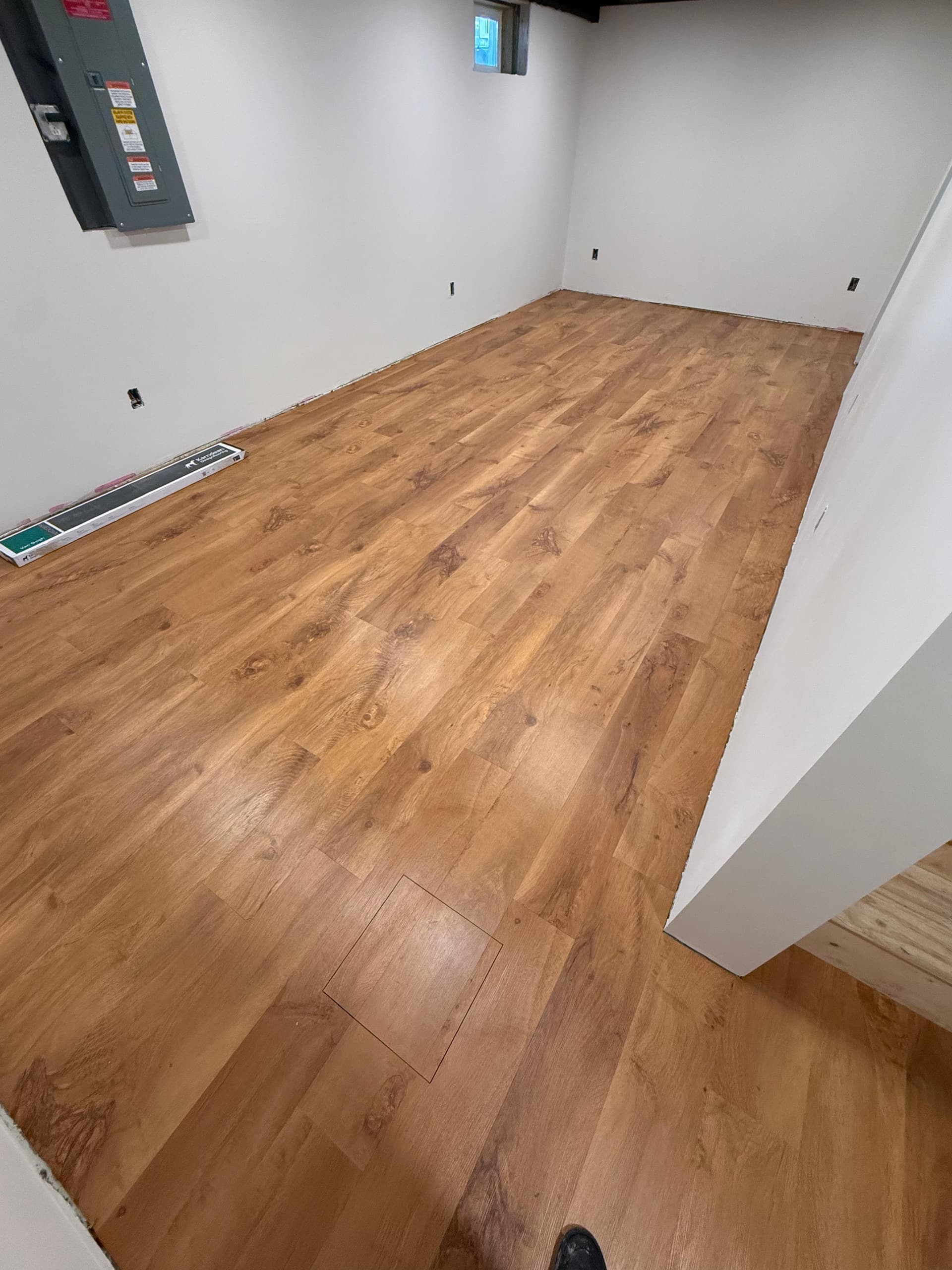Karndean Wellington Oak gluedown luxury vinyl installed in a finished Wethersfield basement room